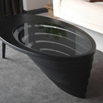 Designer center table with minimalist teardrop outline