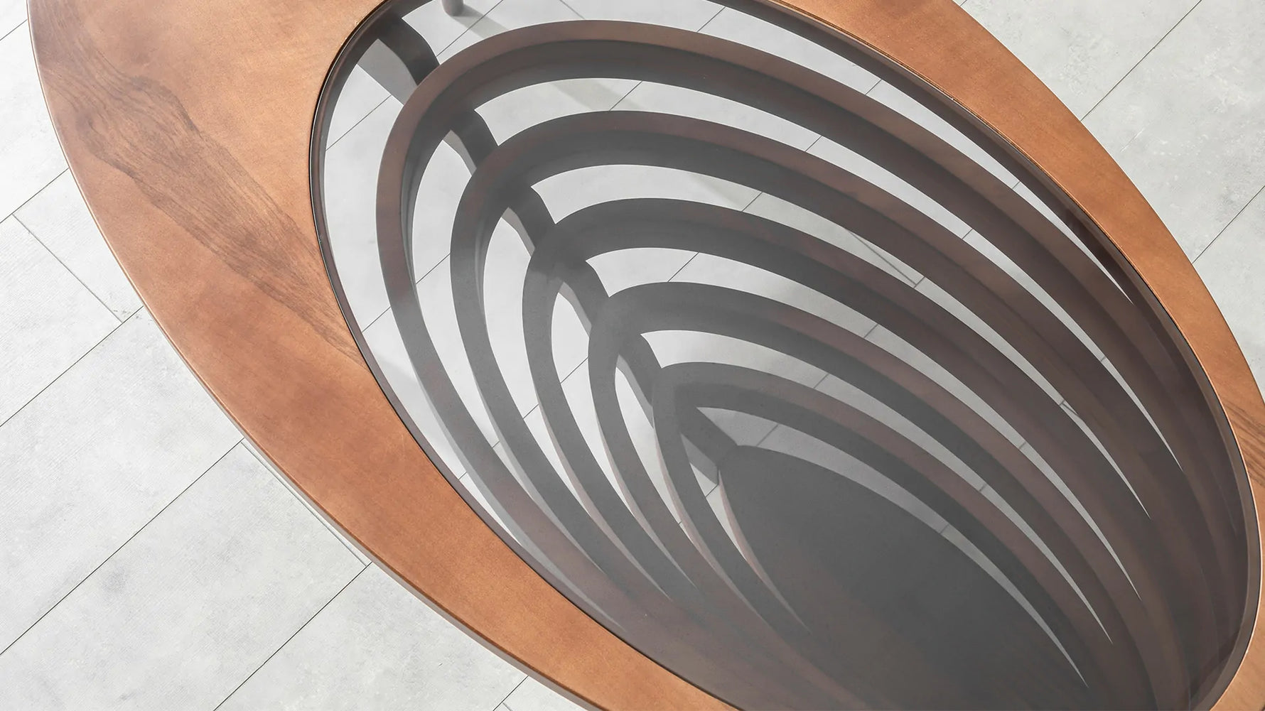 Carved coffee sculpture with elliptical glass center