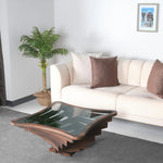 Angular layered coffee table with square transparent surface