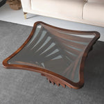 Modern coffee table with curved-edge glass top