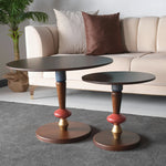 Mid-century style side tables with artistic support stems