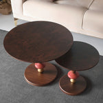 Eclectic round end tables with color block detailing