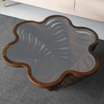 Designer flower form table with glass top and curved lines