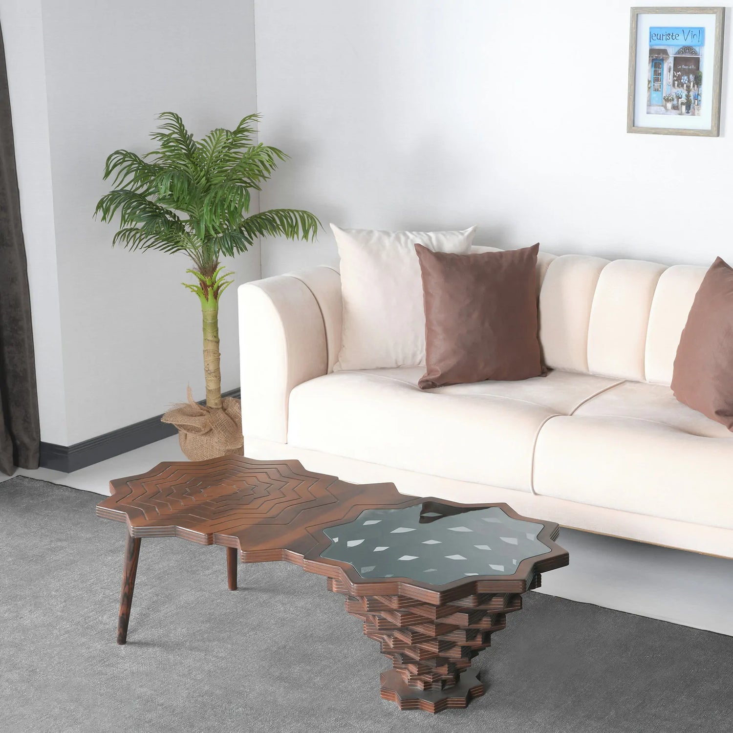 Starburst coffee table with carved wood and sculptural glass top