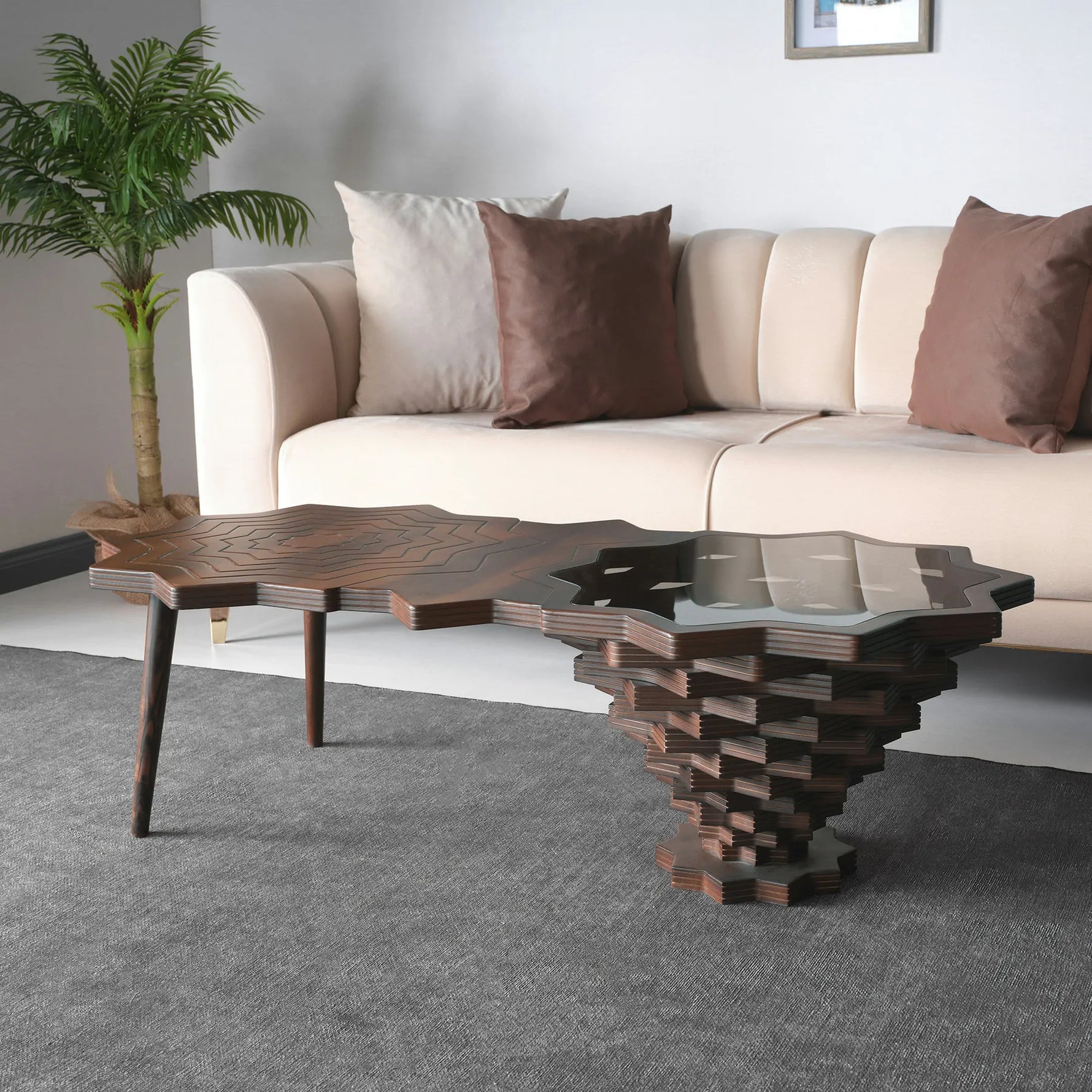 A star-shaped side table with a wooden structure and a dark glass top.