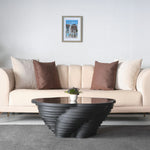 Luxury living room table with organic curves and reflective top