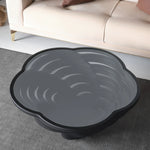 Black sculptural coffee table with cloud-edge silhouette