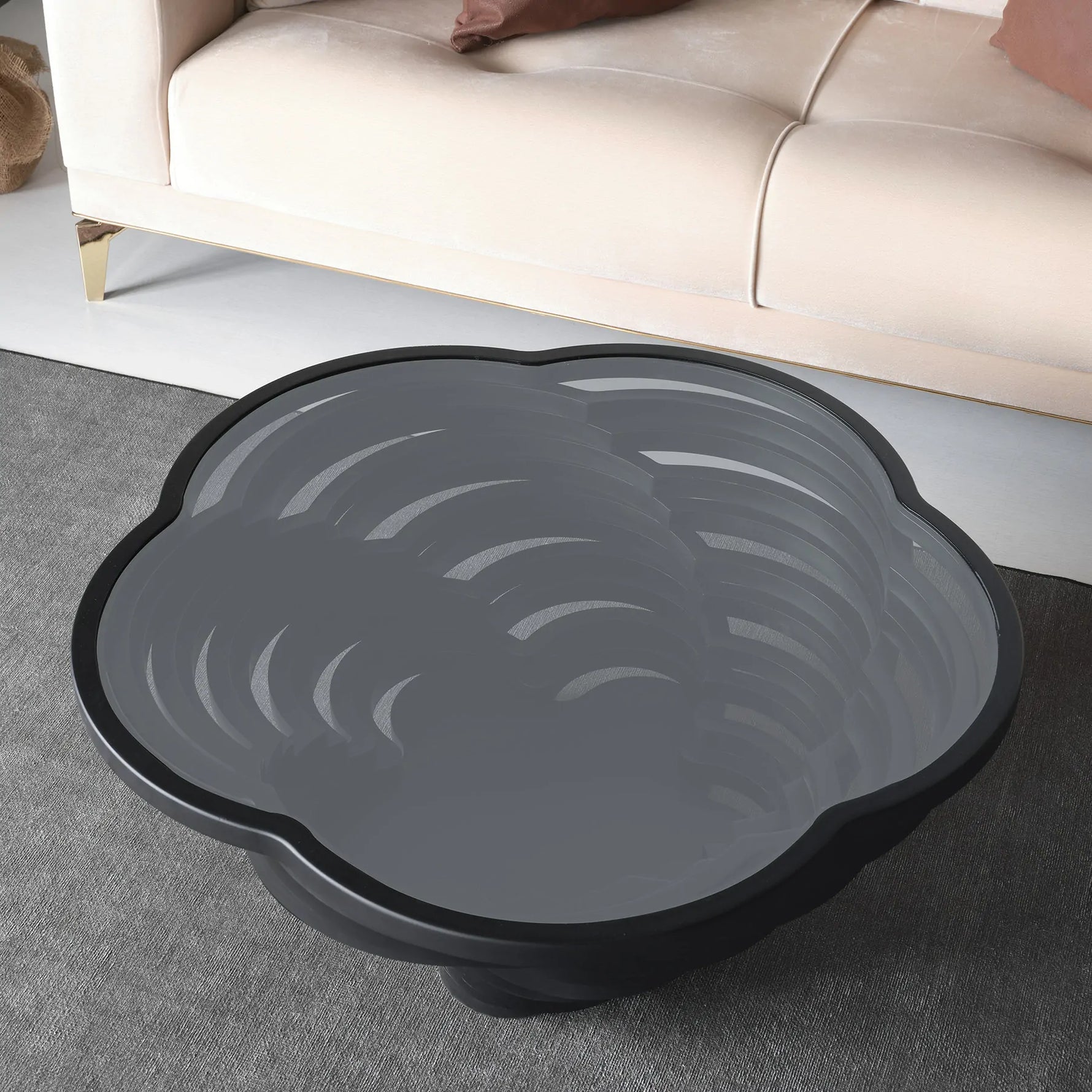 Black sculptural coffee table with cloud-edge silhouette