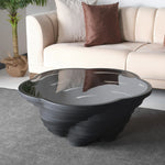 A modern, multi-tiered white coffee table with a glass top, designed by Papella Design, positioned in a living room setting.