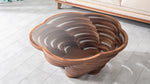 Sculptural glass top table with curved stacked design