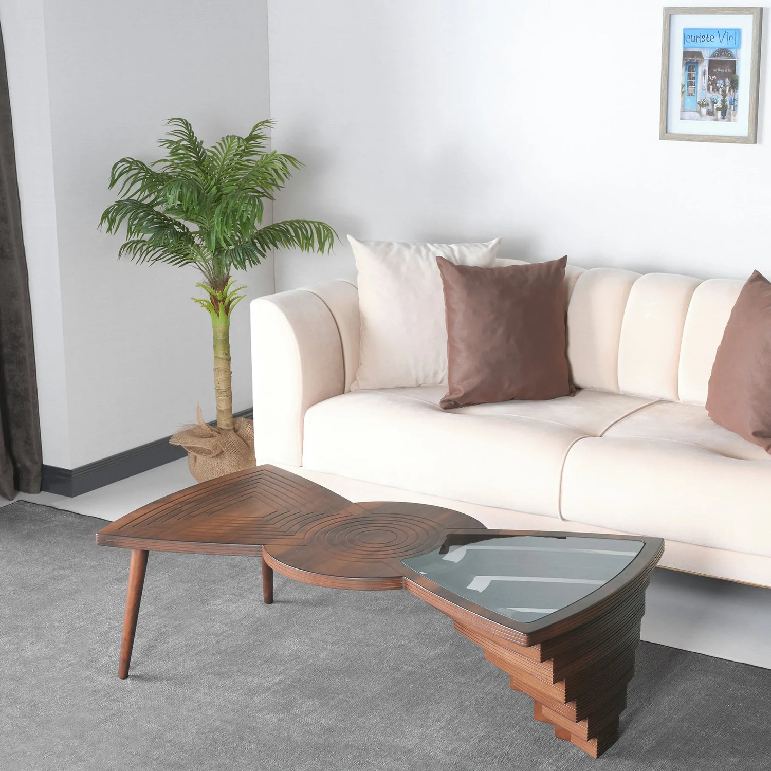 Asymmetrical coffee table with wood and glass dual surface