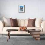 Designer table with engraved wooden top and sculpted leg